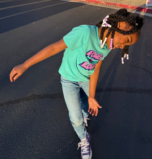 Girl wearing flexiebeads in braided hair.